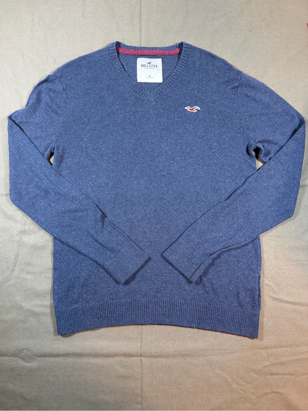 Classic Hollister Men's Blue V-Neck Sweater with Red Logo Accent size M